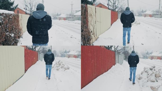 在下雪的天气中行走的人的背