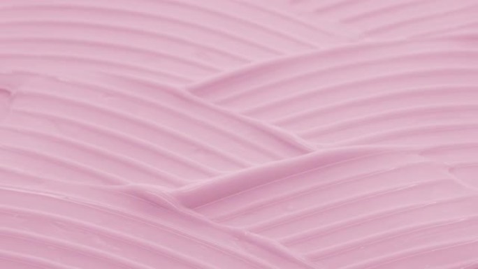 玫瑰油波纹理粉色日霜的宏观起重机镜头