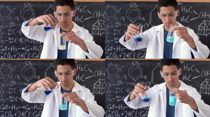 化学课上的年轻阿拉伯学生在实验室中在背景下混合两种液体物质时显示出化学反应