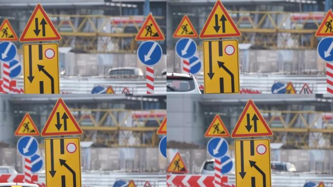 道路工程警告城市街道和缓慢行驶的汽车施工的交通标志