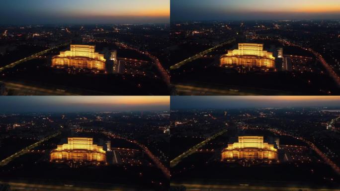 罗马尼亚夜间布加勒斯特市中心议会宫殿的空中无人机视图。周围的多个地区