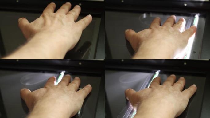 用数字设备扫描人类手掌，生物识别数据收集概念