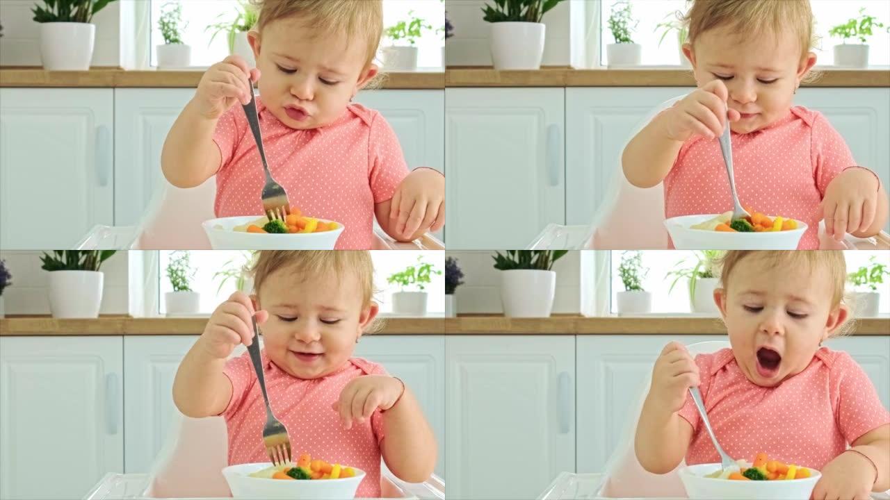婴儿在椅子上吃蔬菜。选择性聚焦。孩子。
