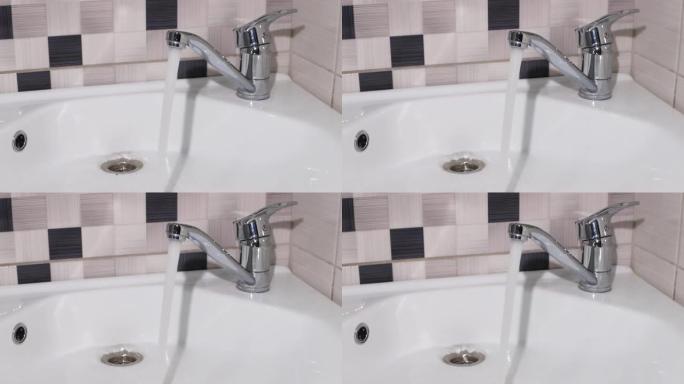 水从水龙头流入浴室特写的盥洗台