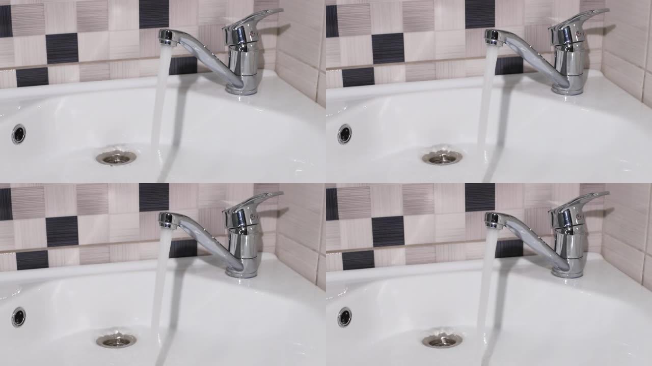 水从水龙头流入浴室特写的盥洗台
