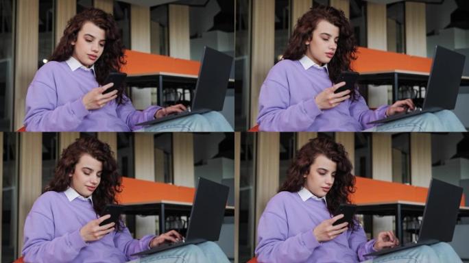微笑的年轻女商人专业使用手机在笔记本电脑上工作坐在舒适的椅子上打字信息。女性顾客制作确认在线网站购物