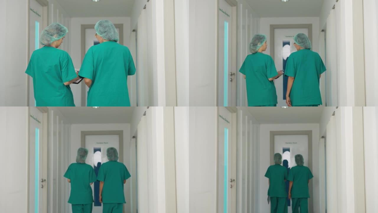 后视外科医生团队交谈并走进手术室。