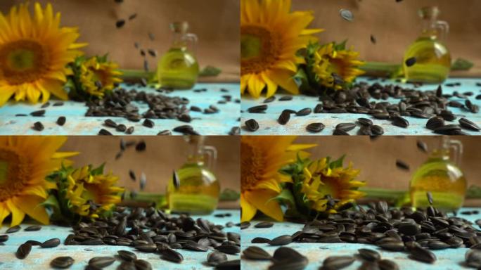 向日葵，蓝色复古木制桌面上的向日葵油和掉落的向日葵种子。慢动作。