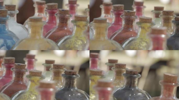 各种颜色的粉末染料在玻璃瓶中油漆