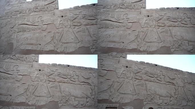 卢克索的卡纳克神庙象形文字，显示牛和人们参加了墙上刻有的节日