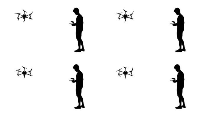一名男子的黑色剪影操作无人驾驶四轴飞行器，动画。