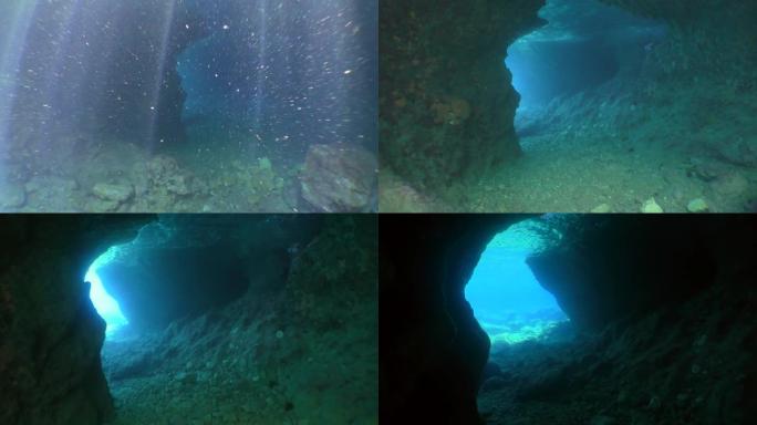 摄像机穿过阳光的窗帘进入水下石洞。