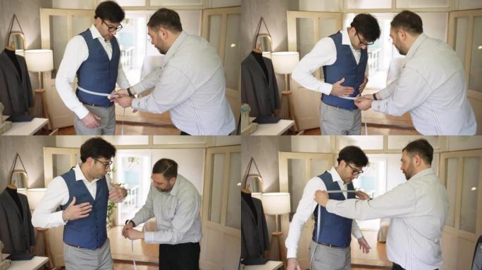 高加索男性裁缝在裁缝车间采取客户的措施