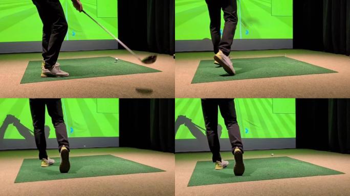 男性高尔夫球手在高尔夫模拟器特写室内打高尔夫球