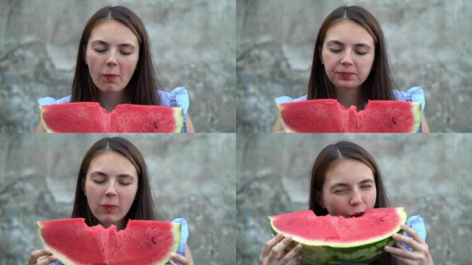 一个年轻漂亮的女人吃西瓜的肖像。