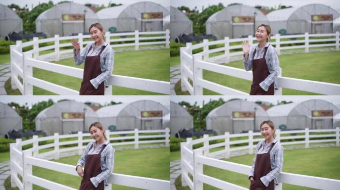 年轻的亚洲女商人作为农民，使用数字平板电脑在她的有机农场温室工作，开始小型和新业务