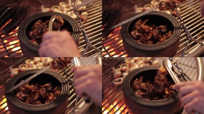男子将烤肉串或烤肉串煮熟的肉放入锅中，煮熟的肉烤肉串，烤肉串