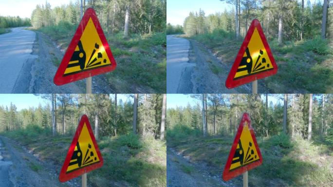 A road sign warning of loose stone chippings on th