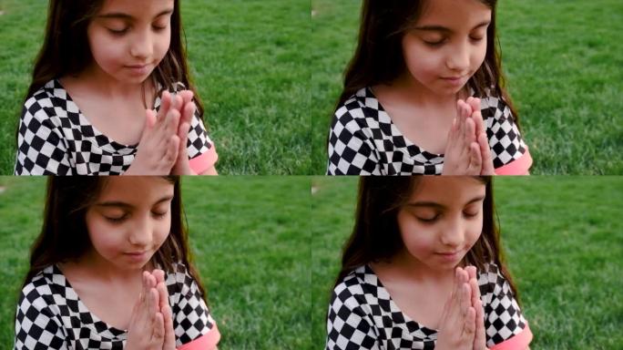 这孩子向上帝祈祷。选择性聚焦。人。