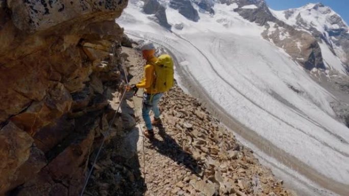 动作相机跟随Alpinist在冰川上方的攀登路线上移动。