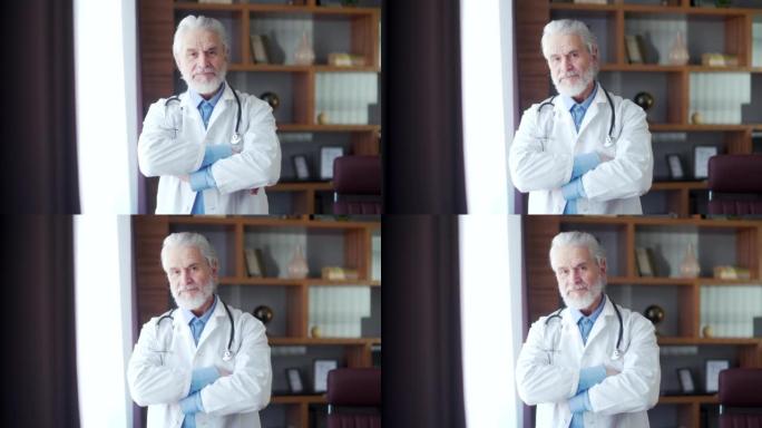 肖像老白发经验丰富的高级医生站在他办公室的一家现代医院诊所里，看着相机。交叉臂