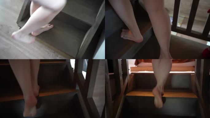 一个女孩在乡间别墅的木制楼梯上赤脚的特写