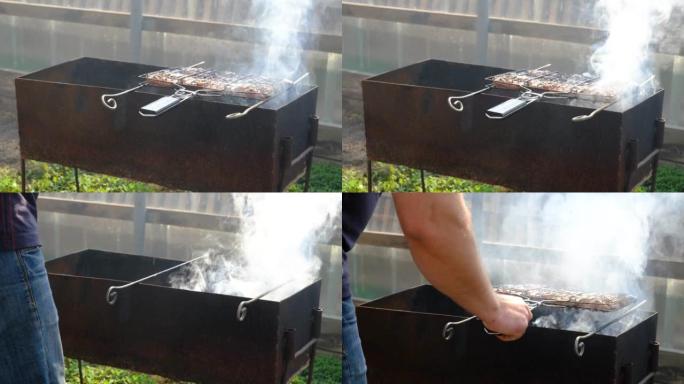 准备猪肉或牛肉牛排的过程。金属烤肉便携式夏季烧烤烧烤烤架。