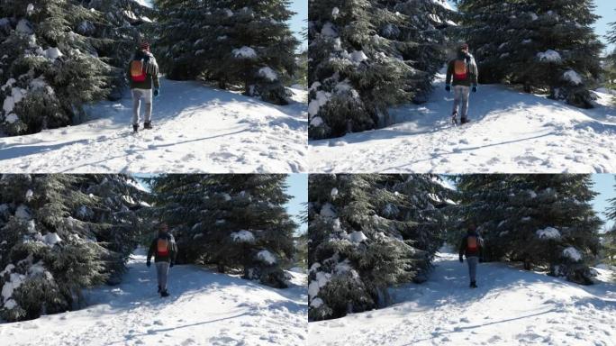 男子在滑雪胜地徒步旅行