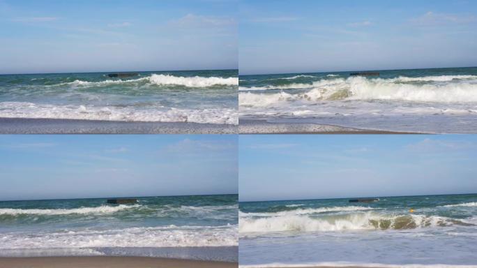 在汹涌的海浪和海沫的海边射击。