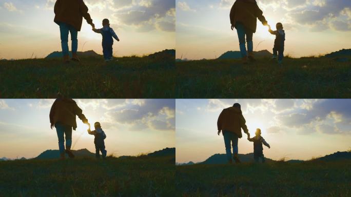 父子父亲与儿子山顶看日落黄昏奔跑亲子陪伴