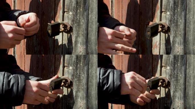 一个人试图用不同的钥匙打开锁