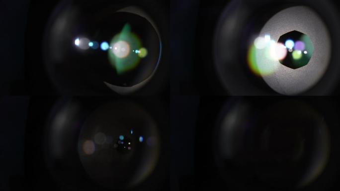 相机镜头光学玻璃上的圆形彩色信号弹。开口光圈叶片的宏观拍摄