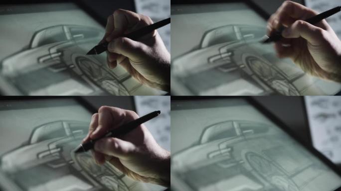 一位工业设计师开发了一种新的汽车概念。一名男子使用专业的图形输入板进行素描。工作
