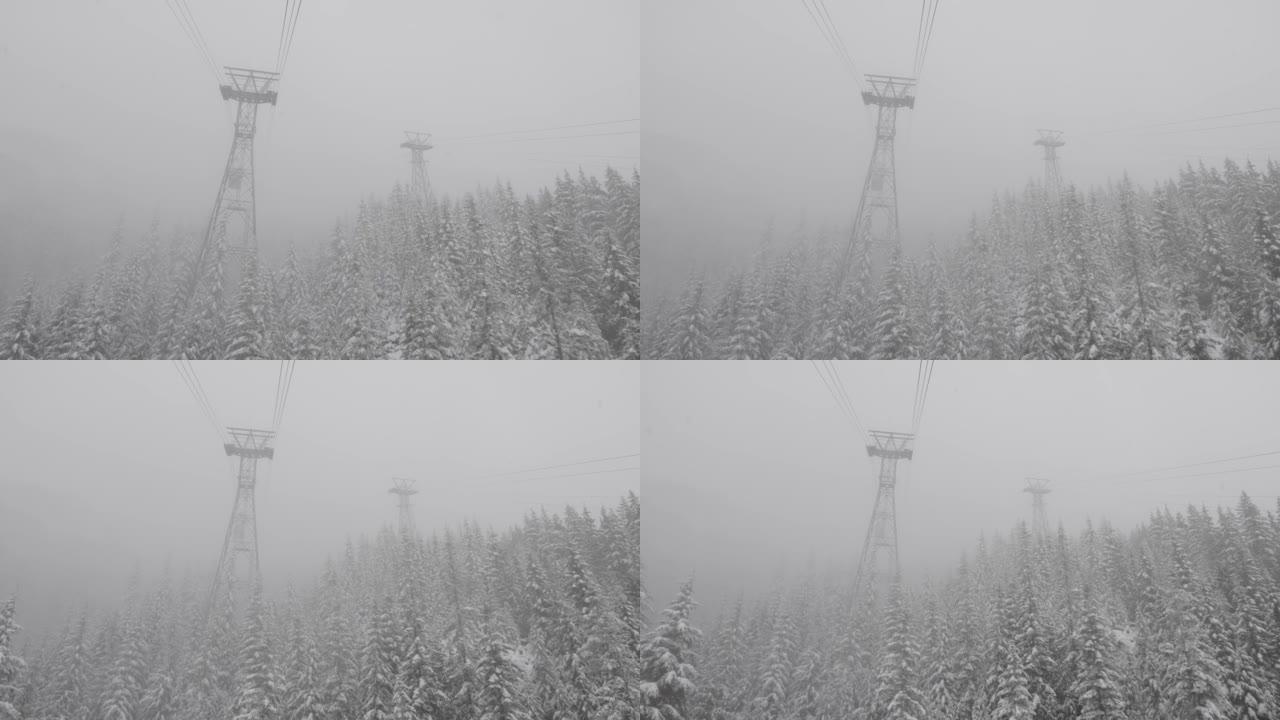 长青树和白雪覆盖的岩石悬崖上的缆车塔的鸟瞰图