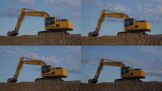 挖掘机上蓝天延时施工现场黄色重型设备铲