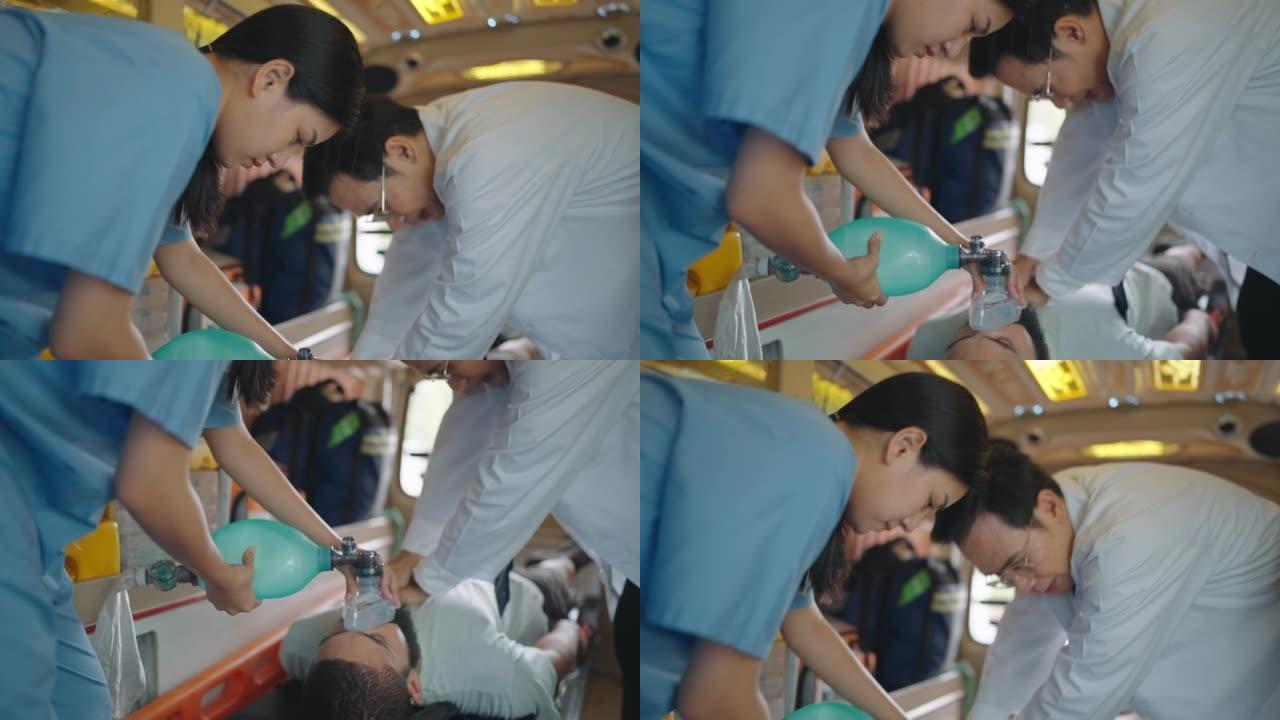 急救人员在急救车的担架上对受伤男子进行心肺复苏术。医疗助理使用口罩呼吸