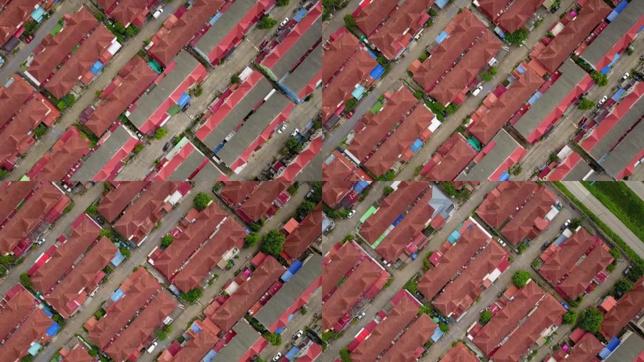 在人口过多的城市中被高密度村庄包围的郊区地区进行空中无人机拍摄，用于住房和房地产物业概念