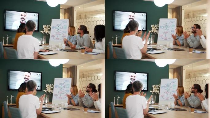 商业专业人士通过视频会议庆祝公司团队会议的成功