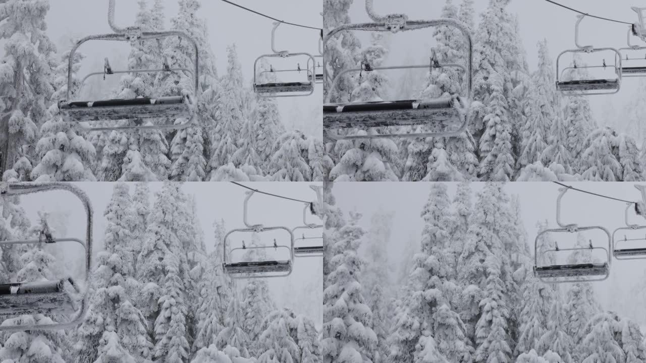 在下雪的冬季，滑雪胜地的缆车被白雪覆盖。