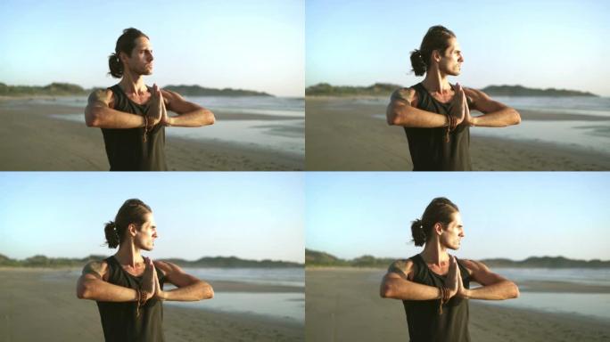 海滩上的调解。年轻的千禧一代瑜伽士练习气功，太极拳瑜伽。