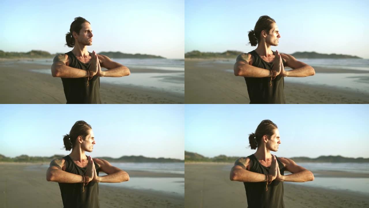 海滩上的调解。年轻的千禧一代瑜伽士练习气功，太极拳瑜伽。