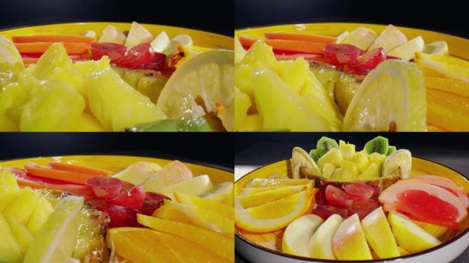 一碗水果: 苹果，猕猴桃，柠檬，橘子，李子，葡萄柚-特写