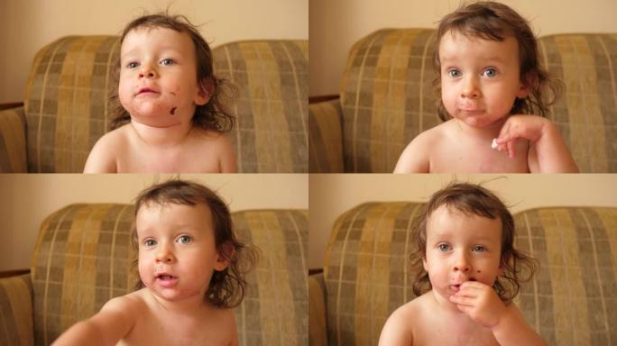 可爱的小宝贝女孩孩子用手吃花椰菜，整个脸都被汤弄脏了
