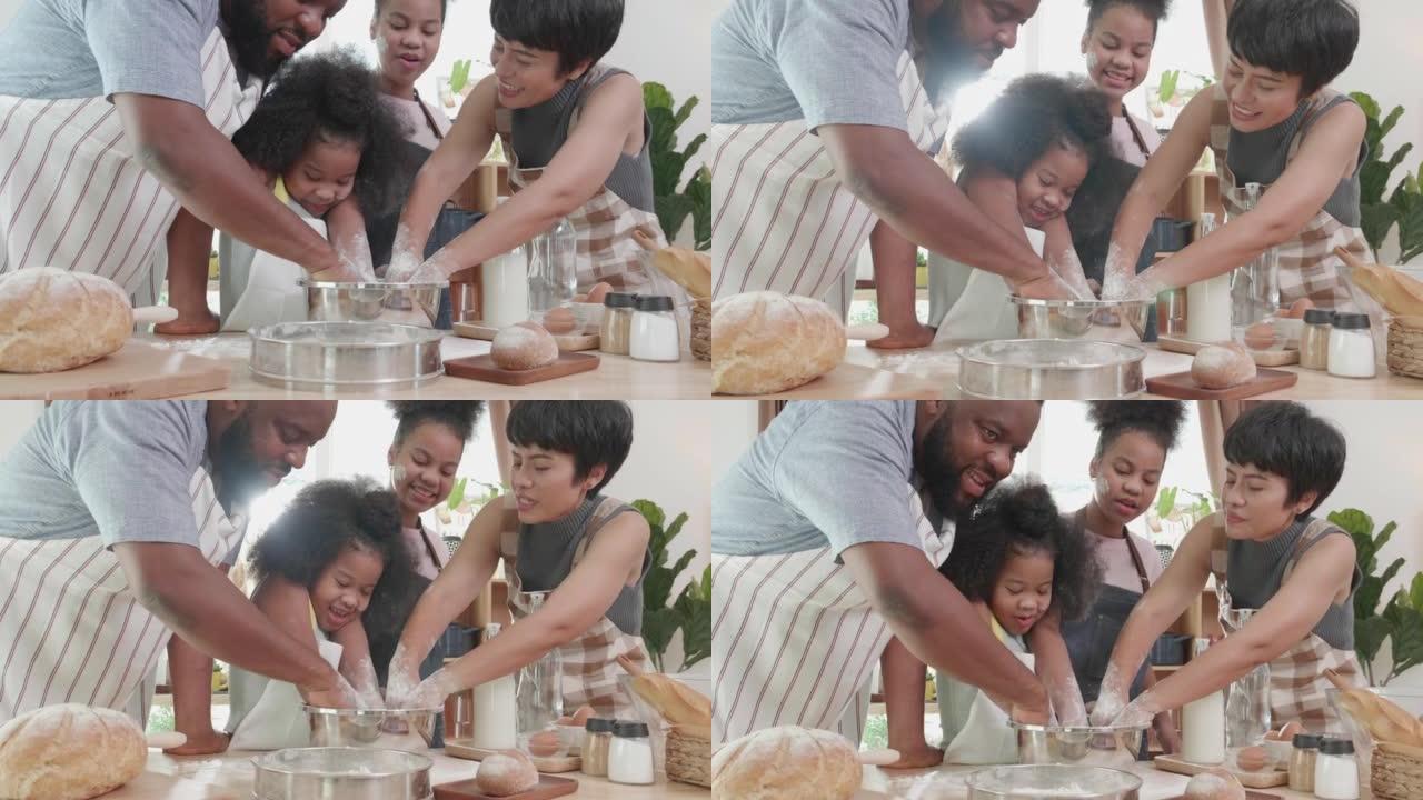 有趣的是非裔美国人家庭在家里的厨房里帮助脱粒面粉做煎饼