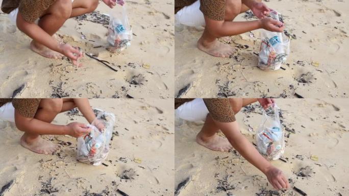 亚洲当地人拿着装满从海滩上带走的垃圾的塑料。水平。