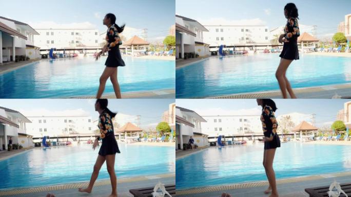 亚洲女孩在室外游泳池附近游泳前热身，激活生活方式概念。