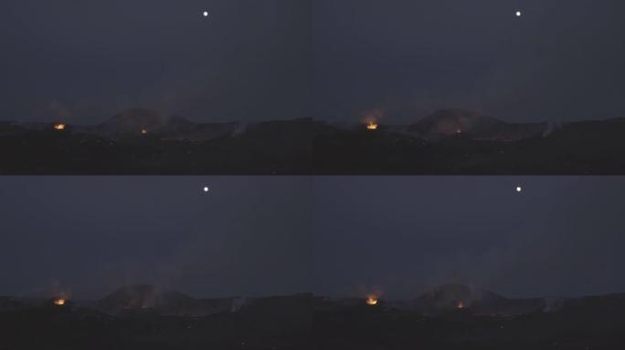 冰岛火山喷发地点上方的满月