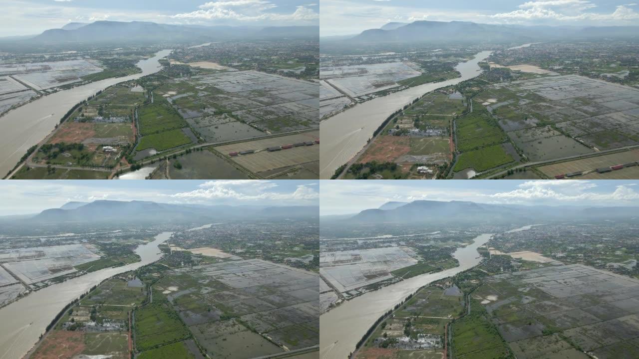 空中无人机拍摄盐田和Praek Tuek Chhu河。贡布市为背景
