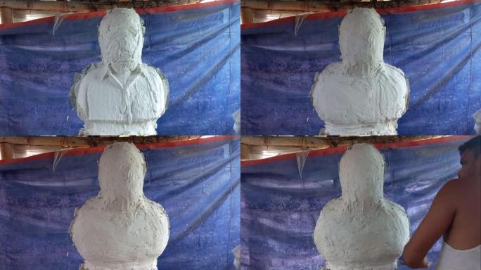 艺术家在粘土半半身雕塑上工作，巴黎铸造石膏