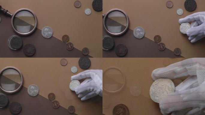 钱币学。木制桌子上的银制成的旧收藏硬币。
